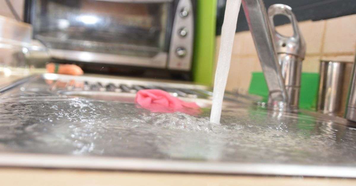 A sink that's overflowing because of a blocked drain